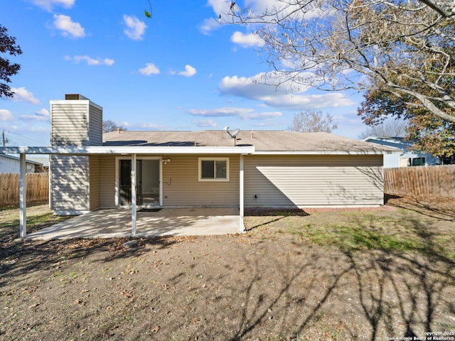 back of property with a patio area