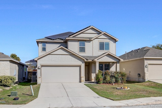 craftsman-style home with central AC, a front lawn, a garage, and solar panels