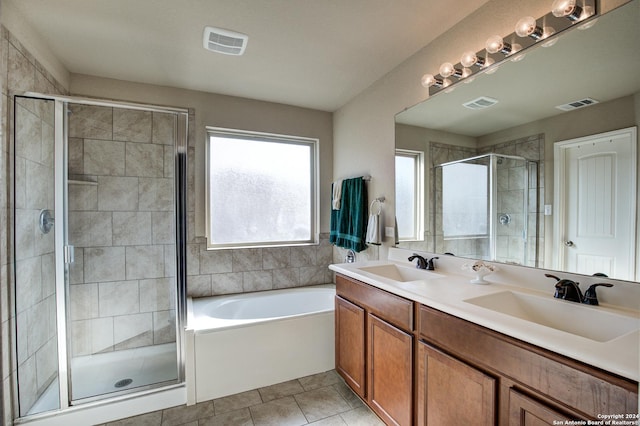 bathroom featuring tile patterned flooring, vanity, and independent shower and bath