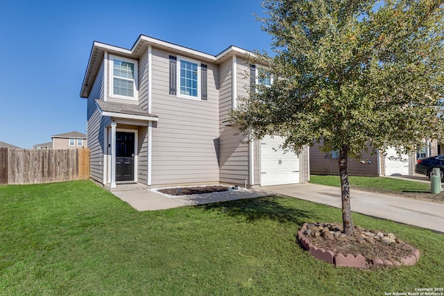 view of front of property with a garage and a front lawn