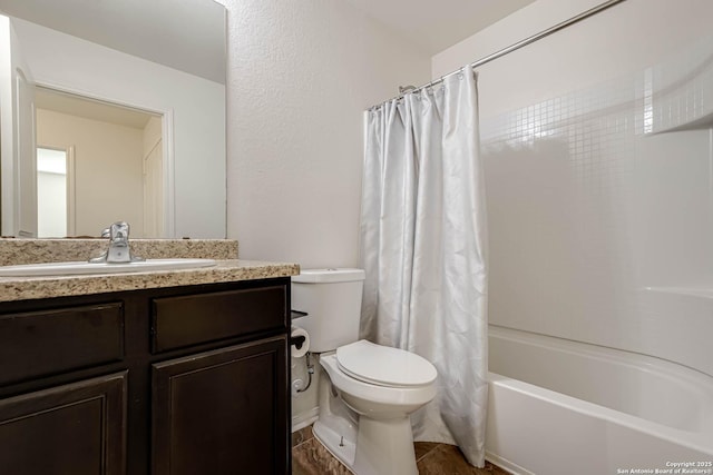 full bathroom featuring toilet, vanity, and shower / tub combo with curtain