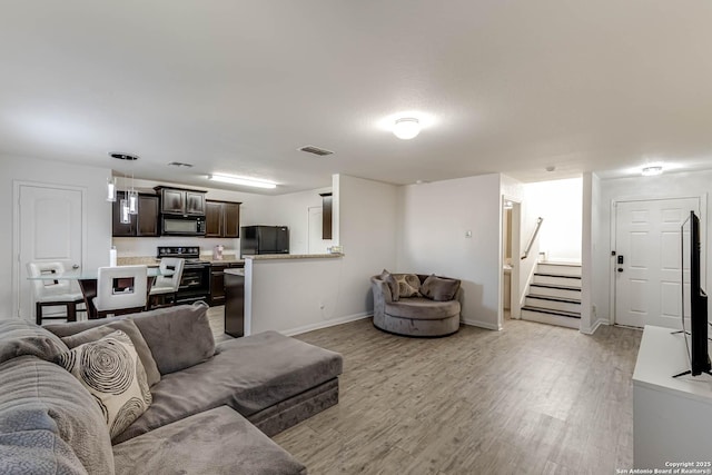 living room featuring light wood-type flooring