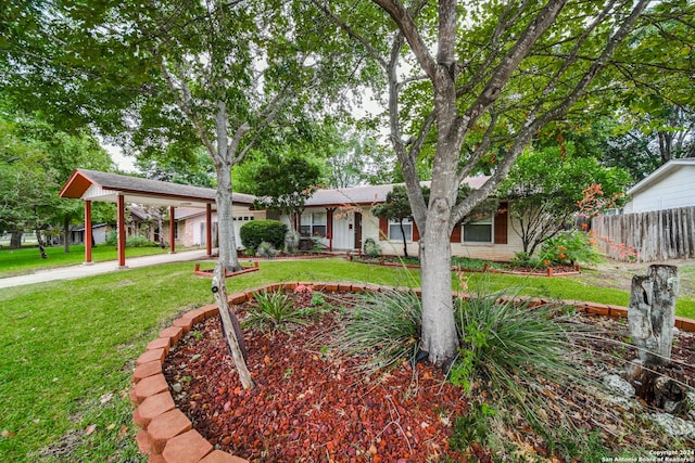 view of front of home with a garage and a front lawn