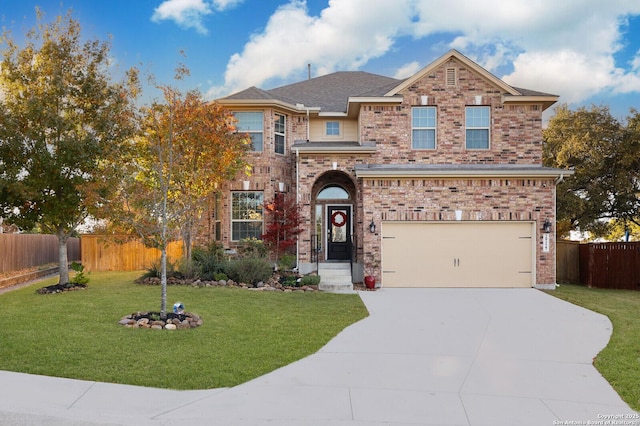 view of front of home featuring a garage and a front lawn