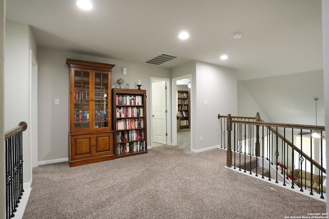 hallway featuring carpet