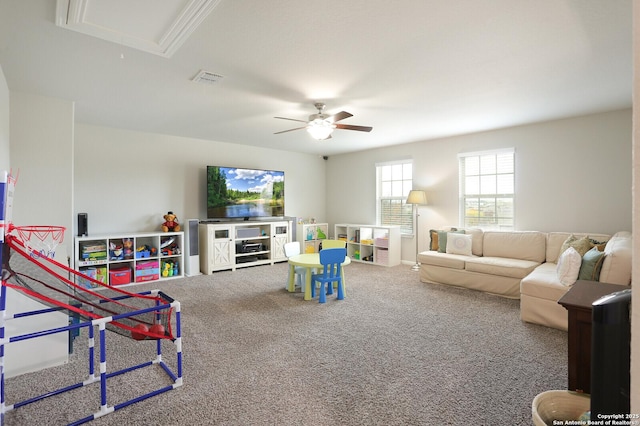 rec room with ceiling fan and carpet floors