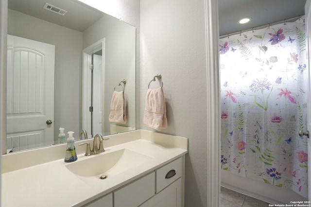 bathroom with vanity and tile patterned floors