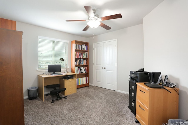 office area with ceiling fan and carpet