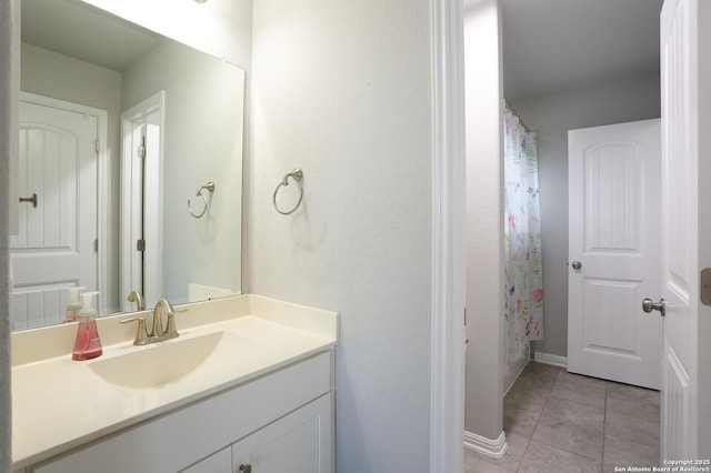 bathroom featuring tile patterned flooring, vanity, and a shower with shower curtain