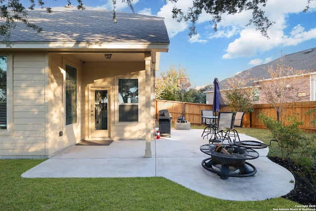 view of patio / terrace featuring a fire pit, a mountain view, and grilling area