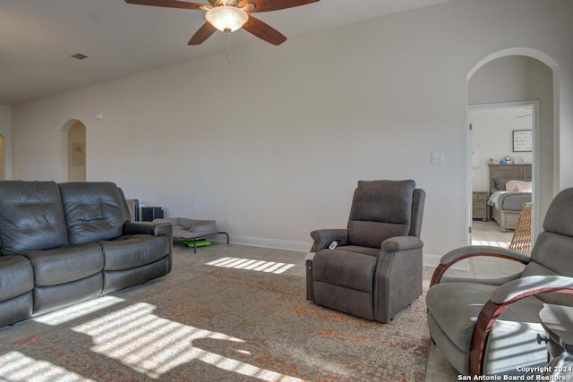 carpeted living room featuring ceiling fan