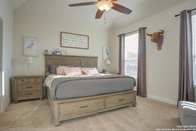 bedroom with ceiling fan and light colored carpet