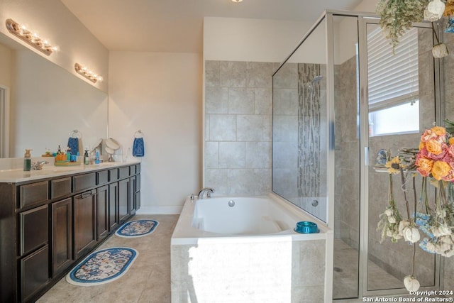 bathroom with tile patterned floors, separate shower and tub, and vanity