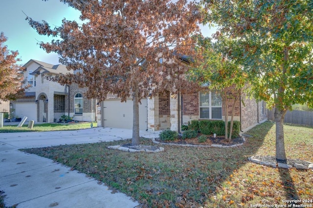 view of property hidden behind natural elements featuring a front lawn