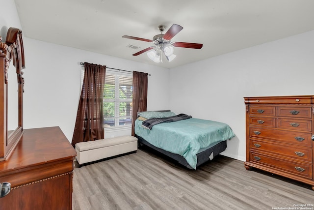 bedroom featuring ceiling fan and light wood-type flooring