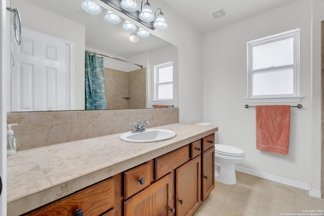 bathroom with decorative backsplash, vanity, toilet, and curtained shower