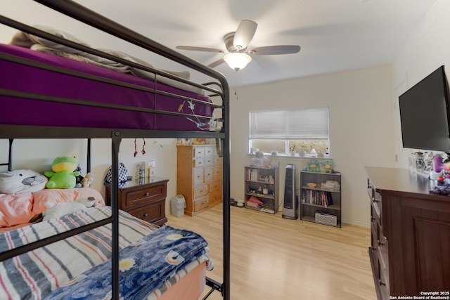 bedroom with ceiling fan and light wood-type flooring