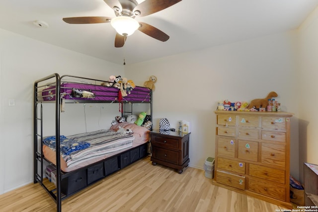 bedroom with ceiling fan and light hardwood / wood-style flooring