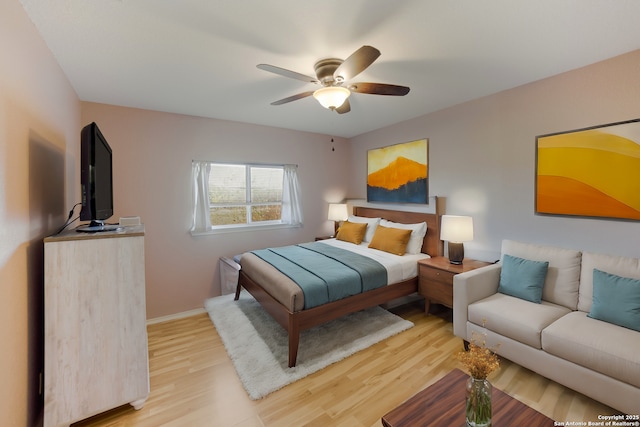 bedroom featuring ceiling fan and light hardwood / wood-style floors