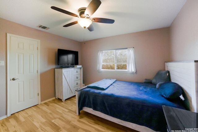 bedroom featuring light hardwood / wood-style floors and ceiling fan