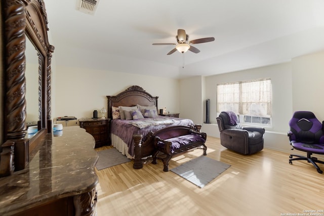 bedroom with ceiling fan and light wood-type flooring