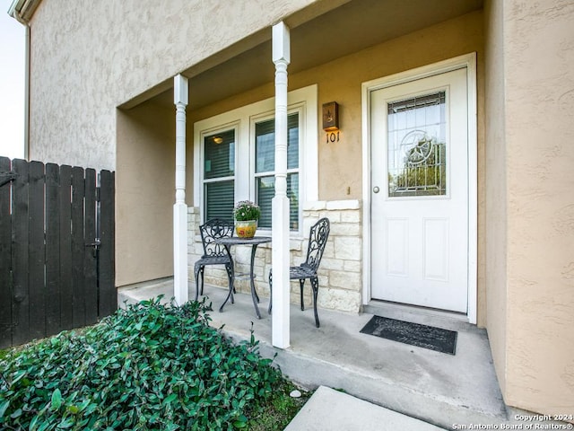 property entrance with covered porch