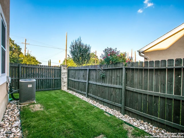 view of yard with central AC