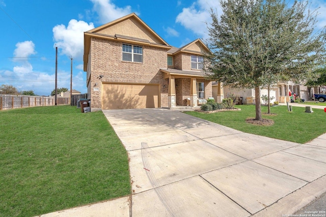 view of front of property with a garage and a front yard