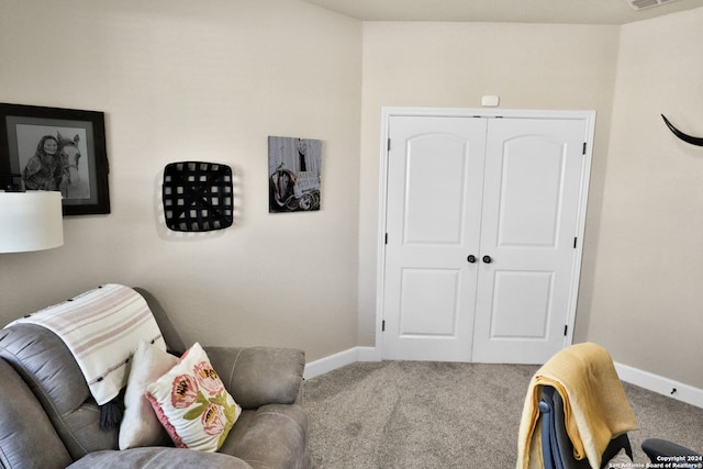 living area featuring carpet flooring