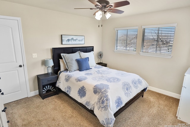 bedroom with ceiling fan and light carpet