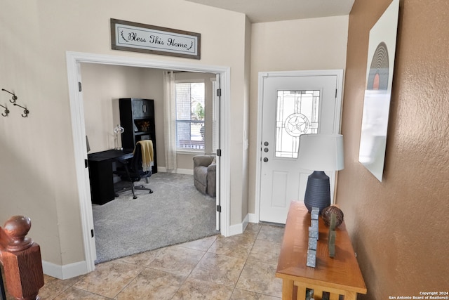 foyer with light carpet