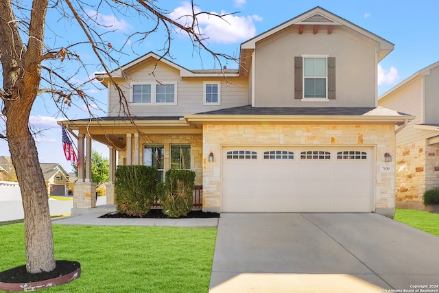 view of front of house featuring a garage and a front yard