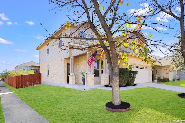 view of front of house featuring a garage and a front lawn