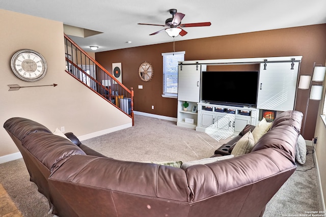 living room with carpet flooring and ceiling fan