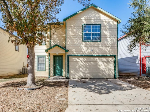 front facade with a garage and central AC