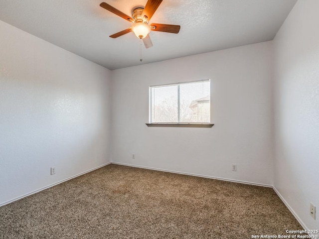 unfurnished room with carpet flooring and ceiling fan