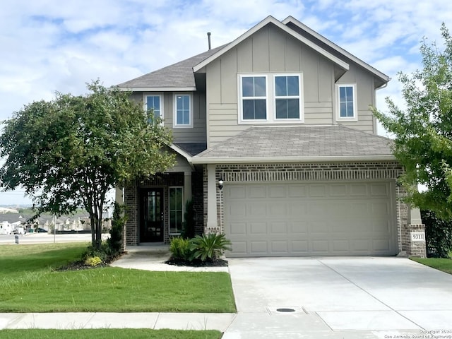 view of front facade with a front lawn and a garage