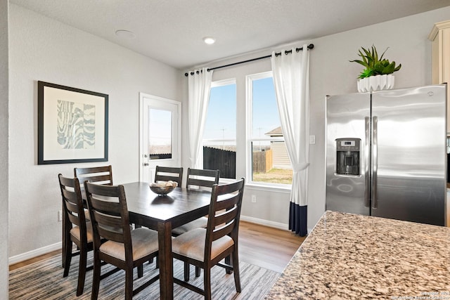 dining space featuring light hardwood / wood-style flooring