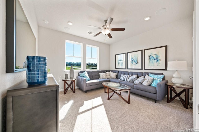 carpeted living room featuring ceiling fan