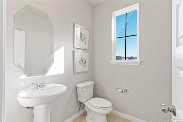 bathroom featuring tile patterned floors and toilet