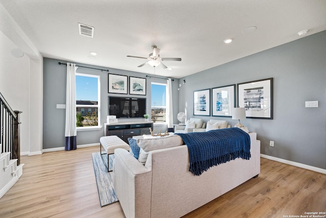 bedroom featuring ceiling fan and light hardwood / wood-style floors