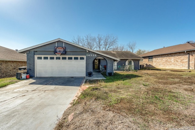 ranch-style house with a front yard and a garage