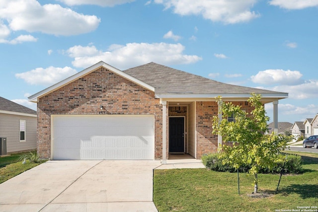 view of front of property with central AC, a garage, and a front lawn