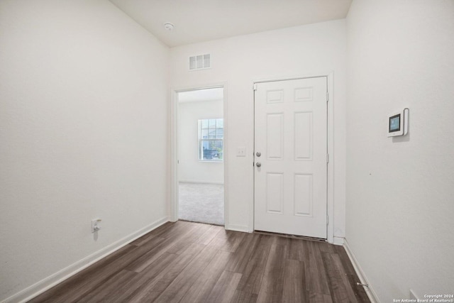 foyer with dark wood-type flooring