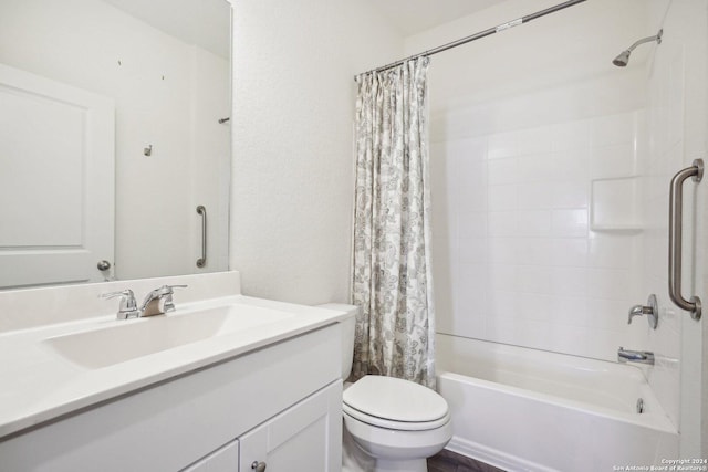 full bathroom with vanity, shower / bath combo, and toilet