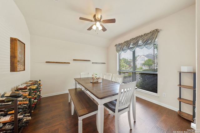 dining space featuring dark hardwood / wood-style floors, ceiling fan, and vaulted ceiling