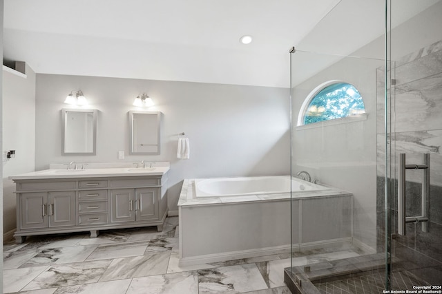 bathroom with vanity, lofted ceiling, and shower with separate bathtub