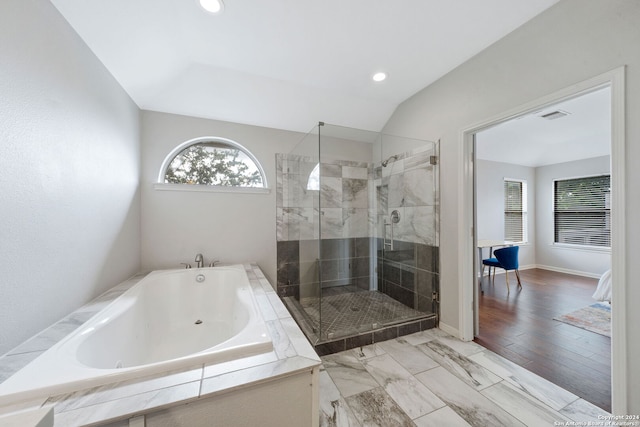 bathroom featuring plenty of natural light and plus walk in shower