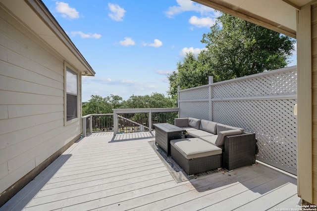 wooden deck featuring outdoor lounge area