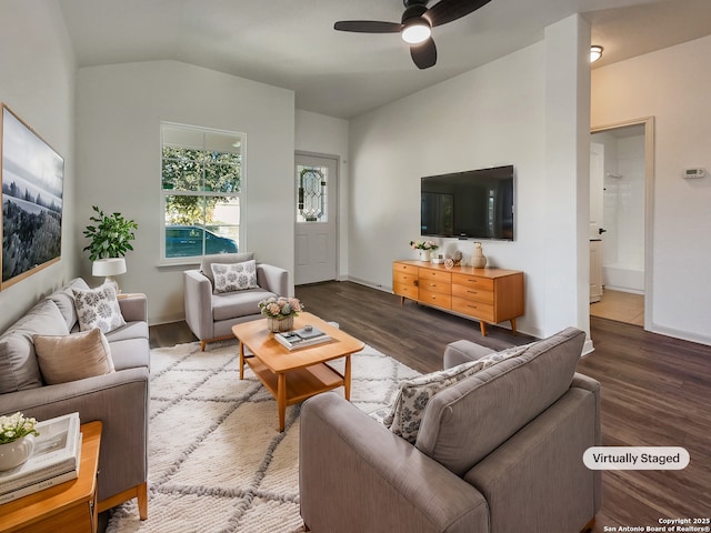 living room with vaulted ceiling, ceiling fan, and dark hardwood / wood-style floors